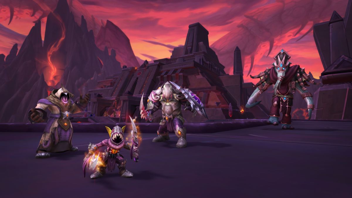 Characters in raid armor standing in a red rocky canyon
